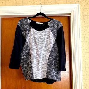 Chloe K boat neck sweater. Printed front with slightly longer black back.